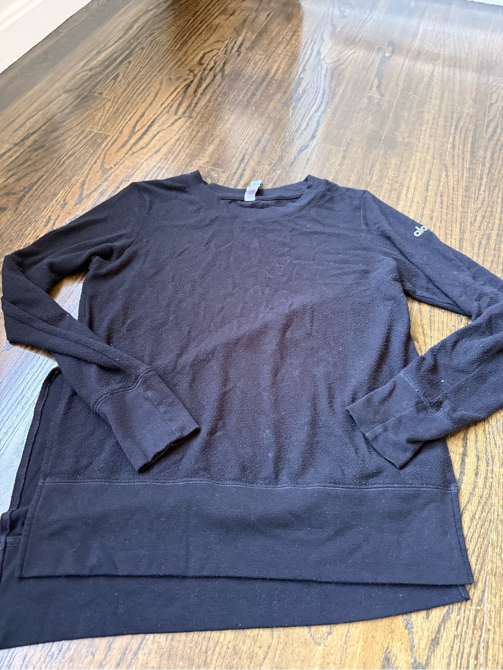Black Long Sleeve Crewneck Sweater. Split in sides. Textures supposed to be